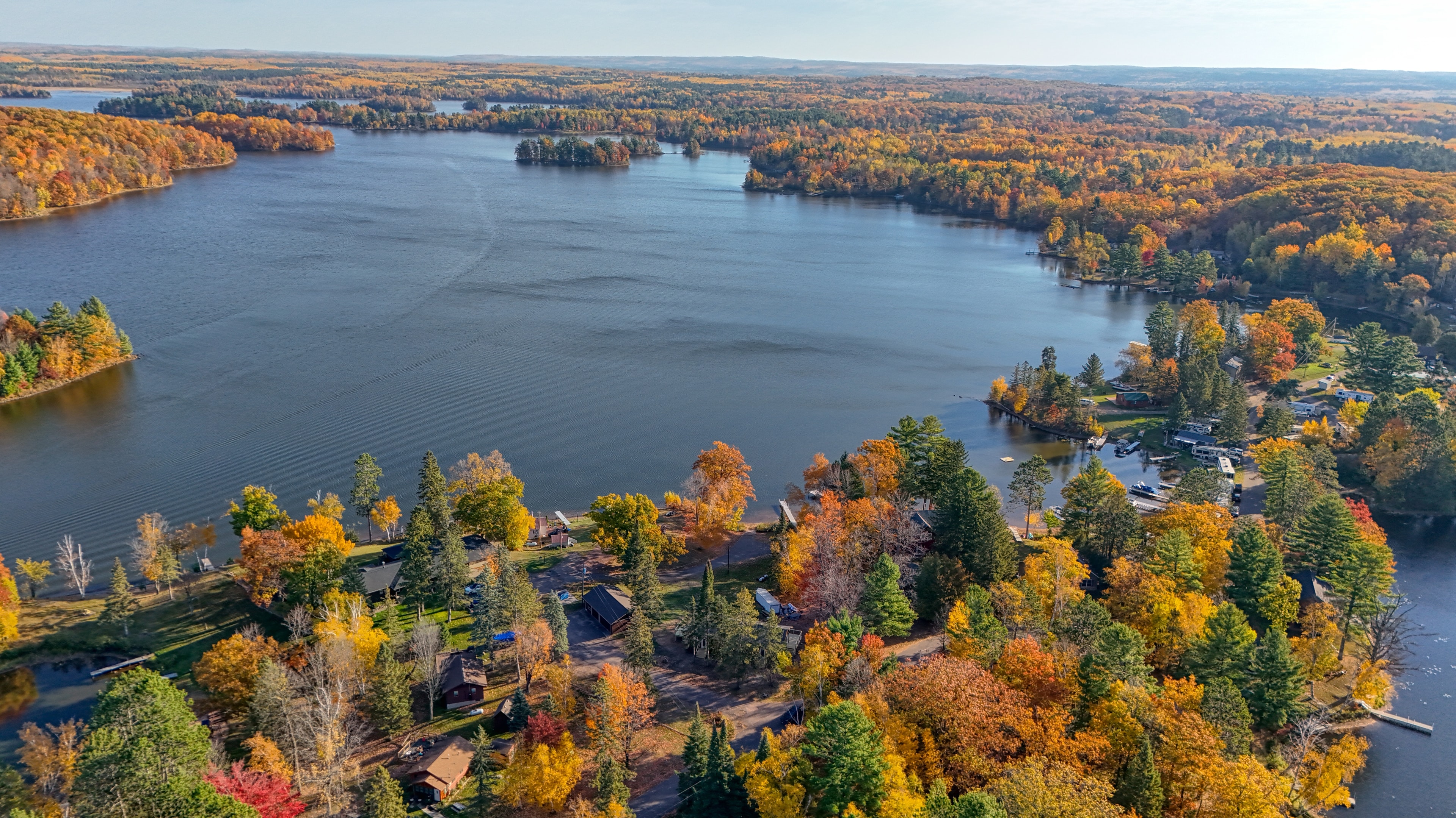 Forested peninsula on Northern Wisconsin lake — aerial view